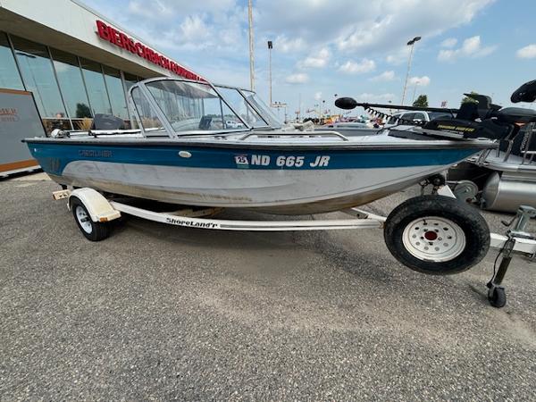 Crestliner Sportfish 1750 1995 Crestliner 1750 Sport Fish boat on trailer, parked outdoors.
