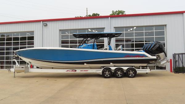 Nor-Tech 390 Sport Center Console 2023 Nor-Tech 390 Sport Center Console boat on trailer outside a garage.