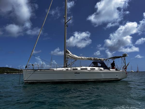 Dufour 40 Performance Sailboat Dufour 40 Performance 2006 on calm sea under a partly cloudy sky.