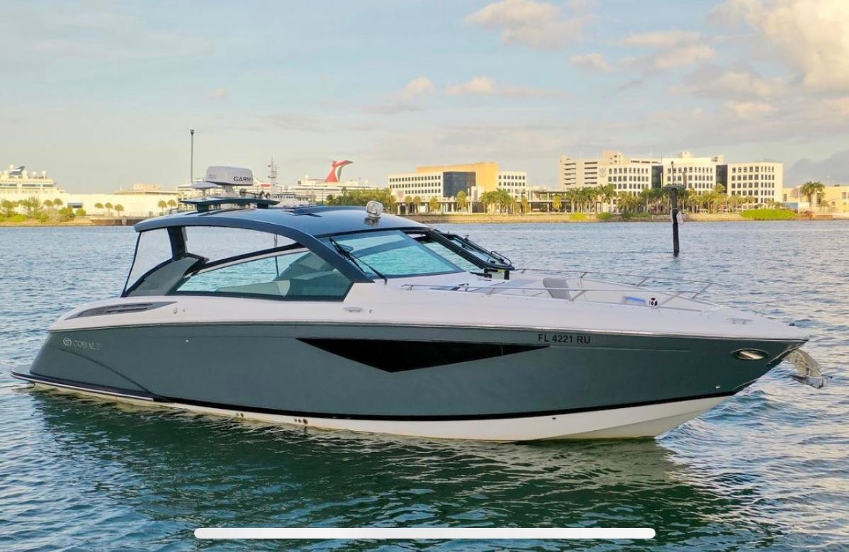 Cobalt A36 2018 Cobalt A36 boat on water with cityscape background.