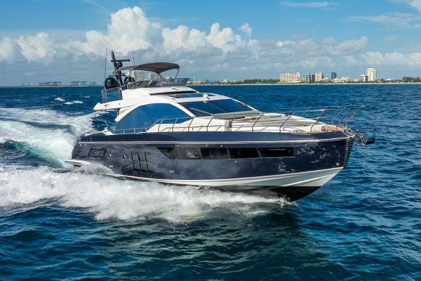 Azimut S7 2019 Azimut S7 yacht cruising on open water under a clear blue sky.