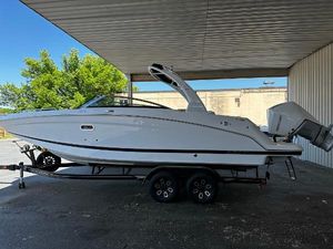 Four Winns HD8 OB 2023 Four Winns HD8 OB boat on a trailer under a metal canopy.