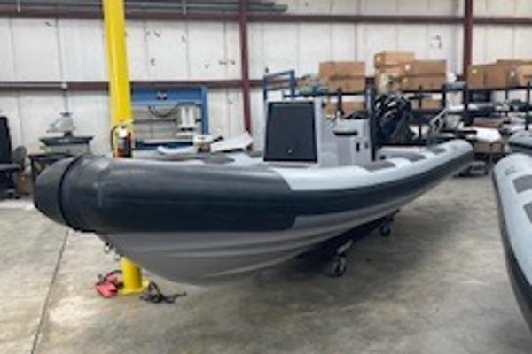 Fluid Watercraft Patrol 21 2025 Fluid Watercraft Patrol 21 boat in a warehouse setting.