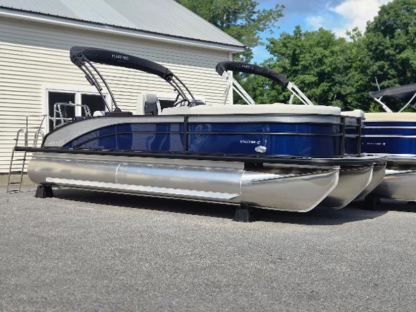 Harris Cruiser 230 2025 Harris Cruiser 230 pontoon boat with blue exterior, parked outdoors.