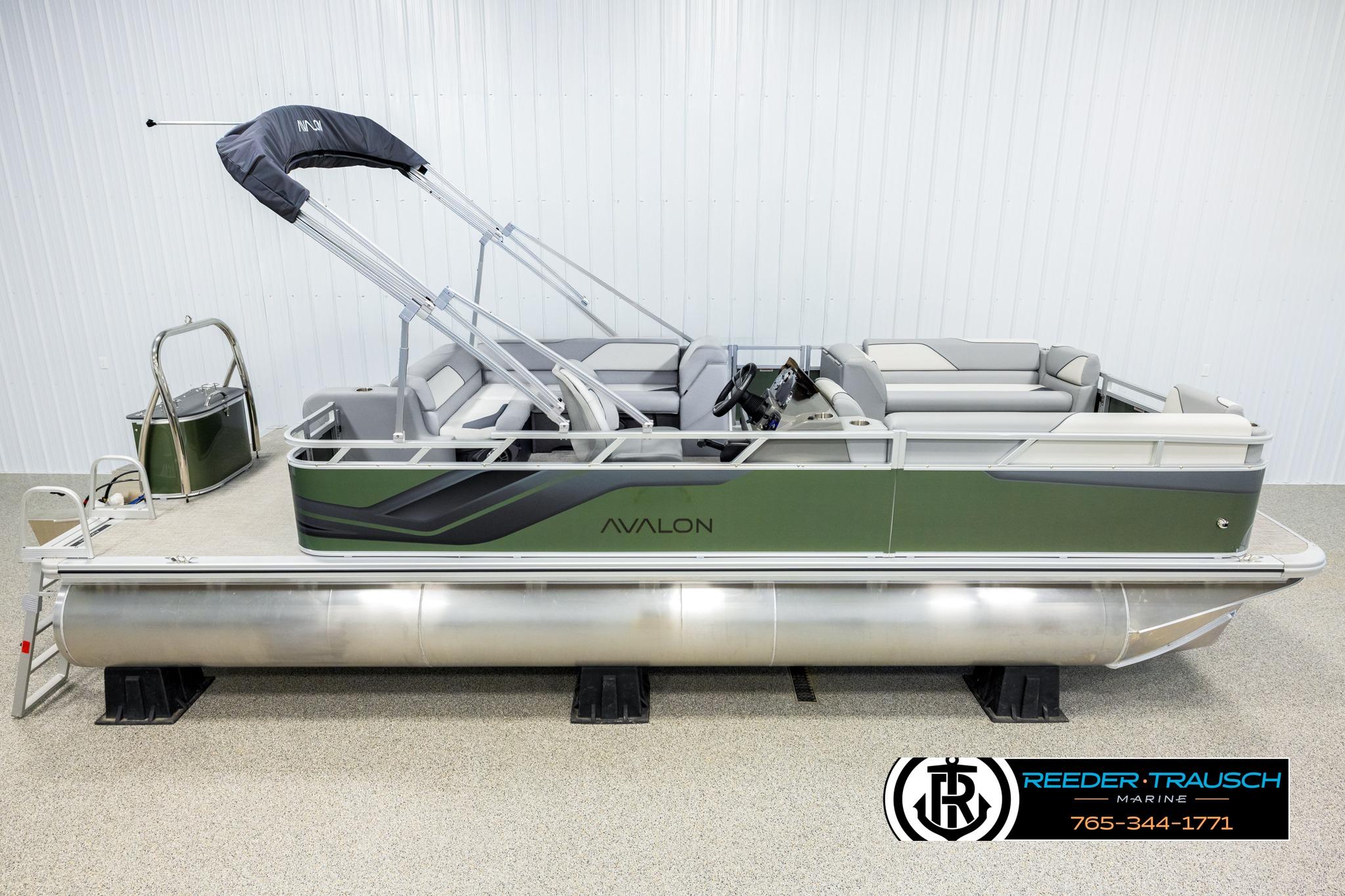 Avalon VEN CRB 2026 Avalon VEN CRB pontoon boat with canopy, displayed indoors at Reeder-Trausch Marine.