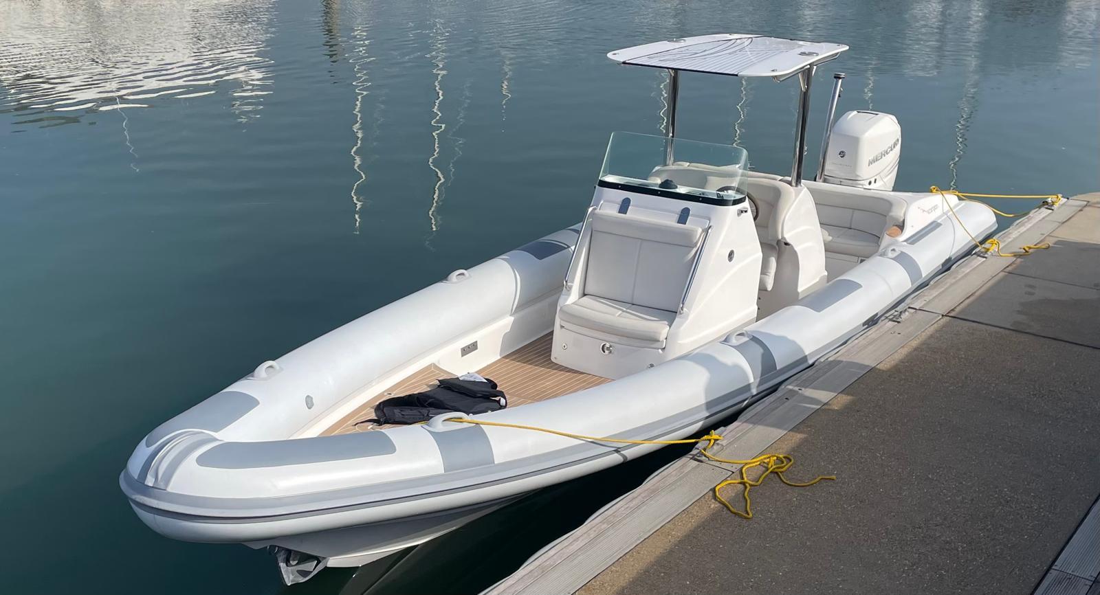 Scorpion Serket 88 2015 Scorpion Serket 88 boat docked on calm water, featuring sleek design and modern outboard motor.