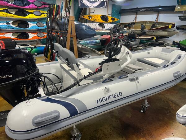 Highfield Classic 360 FCT 2025 Highfield Classic 360 FCT inflatable boat in showroom with kayaks and equipment.