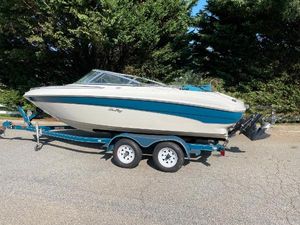 Sea Ray 190 Signature 1997 Sea Ray 190 Signature boat on trailer, parked outdoors.