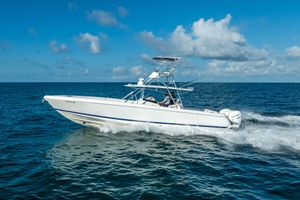 Intrepid 400 Center Console 2016 Intrepid 400 Center Console boat cruising on open ocean under blue sky.