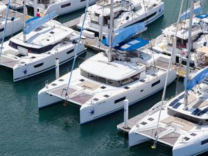 Lagoon 52 F Aerial view of 2022 Lagoon 52 F catamarans docked in a marina.