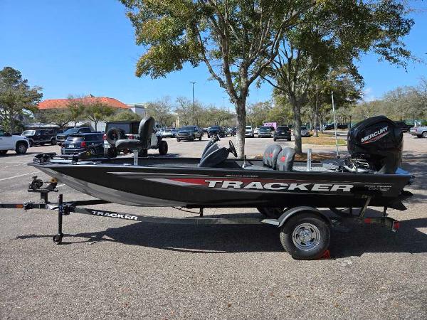 Tracker Pro Team 175 Crappie Edition 2025 Tracker Pro Team 175 Crappie Edition boat in parking lot, side view.