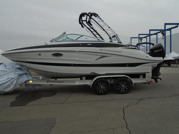 Crownline E 240 XS 2024 Crownline E 240 XS boat on trailer, side view, overcast day.