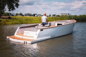Cooper 1000 A 2018 Cooper 1000 boat cruising on a calm river with a person steering.