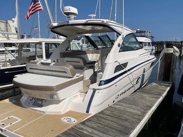 Regal 35 Sport Coupe 2018 Regal 35 Sport Coupe docked at marina, showcasing sleek design and luxury features.