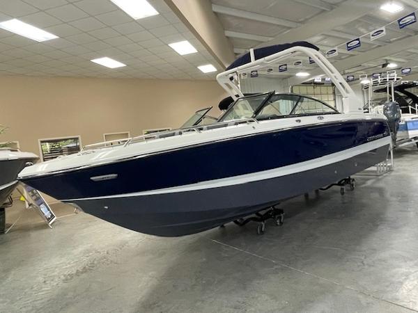 Chaparral 247 SSX 2025 Chaparral 247 SSX boat displayed indoors, featuring sleek design and modern amenities.