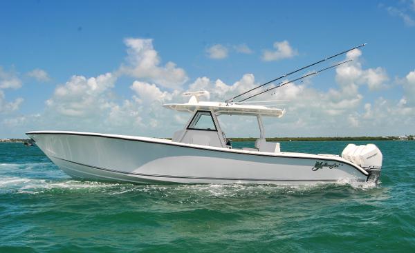 Yellowfin 39 Offshore 2022 Yellowfin 39 Offshore boat cruising on clear blue water under a sunny sky.