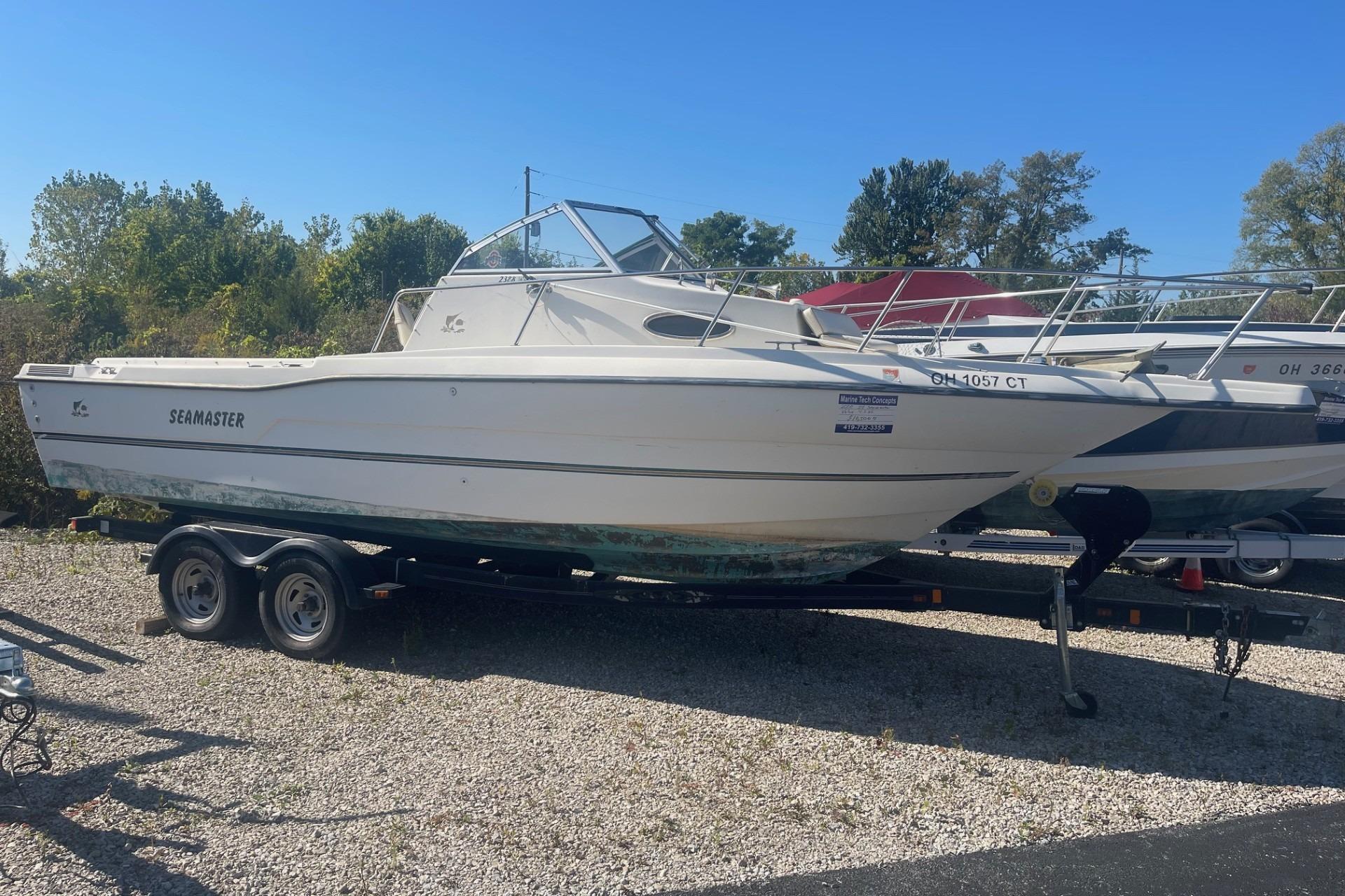 Seamaster 2388 WA 2000 Seamaster 2388 WA boat on trailer, parked outdoors on gravel.