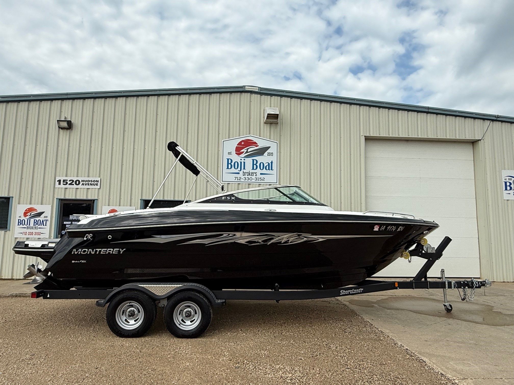 Monterey 244FSX 2015 Monterey 244FSX boat on trailer outside Boji Boat building.
