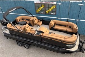 Regency 230 LE3 2025 Regency 230 LE3 pontoon boat with tan seating, displayed at Sizzle Marine, Ohio.