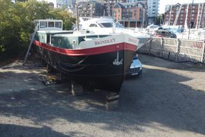 Dutch Barge Replica Dutch Barge 57ft 2008 Replica Dutch Barge 57ft named Brindley, docked in a marina setting.