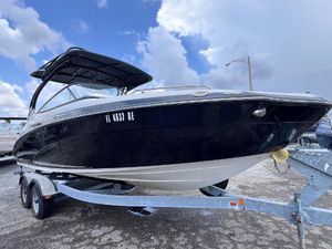 Yamaha Boats 242 Limited S E-Series 2016 Yamaha Boats 242 Limited S E-Series on trailer, under cloudy sky.