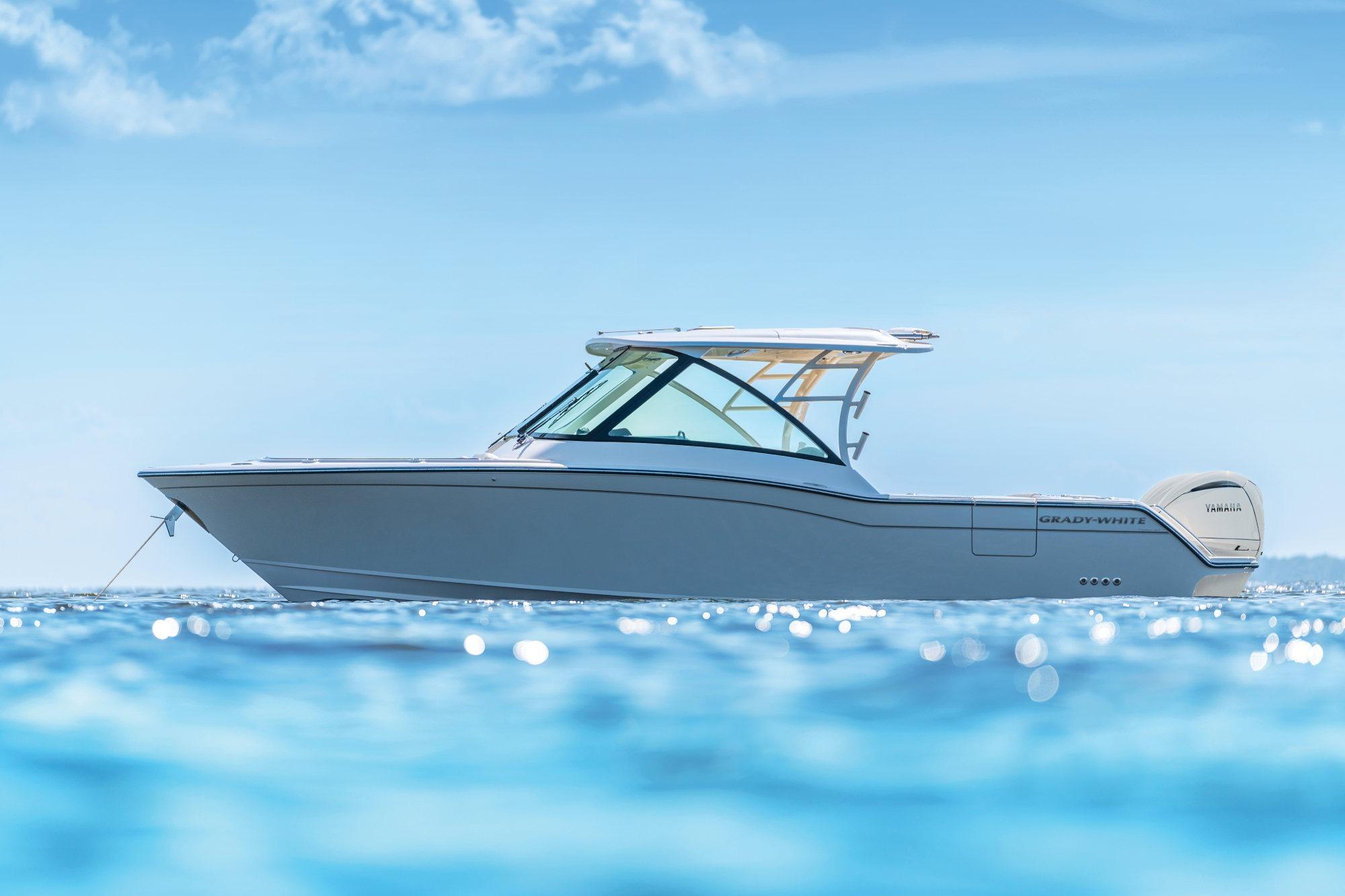 Grady-White Freedom 325 2026 Grady-White Freedom 325 boat on calm blue ocean waters.