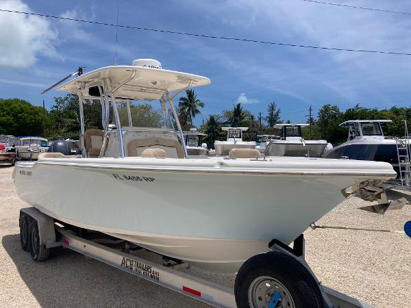 Key West 263 FS 2018 Key West 263FS boat on trailer under clear blue sky.