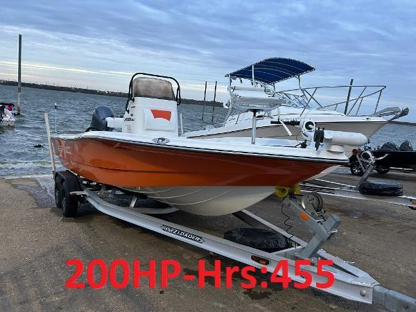 Epic 22 SC 2013 Epic 22 SC boat on trailer, 200HP engine, 455 hours, docked by the water.