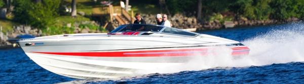 Formula 382 FASTech 2014 Formula 382 FASTech speedboat cruising on a lake with passengers onboard.