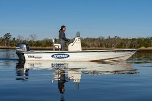 Pathfinder 2000 V A person on a 2005 Pathfinder 2000v boat named "Desperado" on calm water.