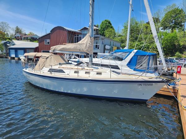 O'Day 35 1985 O'Day 35 sailboat docked at a marina on a sunny day.