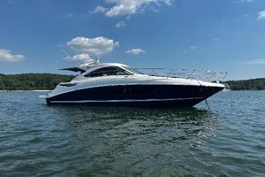Sea Ray 510 Sundancer 2014 Sea Ray 510 Sundancer yacht on calm water under a clear blue sky.