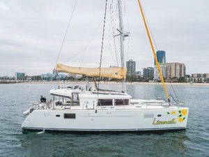 Lagoon 450F 2016 Lagoon 450F catamaran sailing near city skyline.