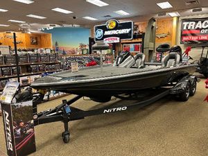 Nitro Z21 XL 2025 Nitro Z21 XL boat displayed in a showroom with Mercury signage.