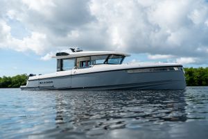Saxdor 340 GTWA 2026 Saxdor 340 GTWA boat on calm water under cloudy sky.