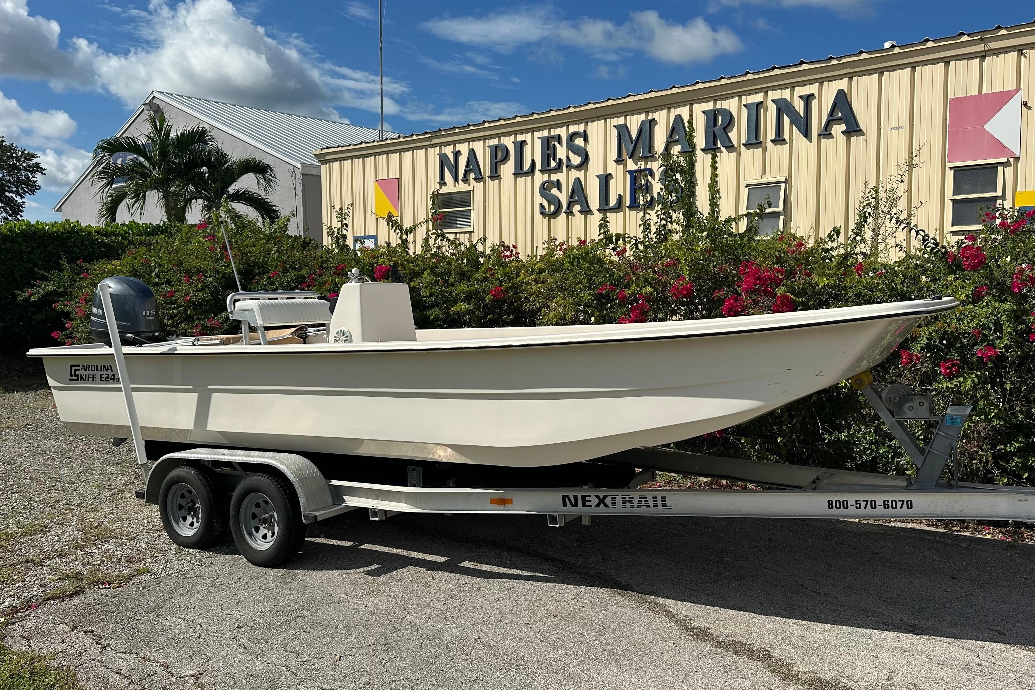 Carolina Skiff E24 DLX CC 2024 Carolina Skiff E24 DLX CC boat on trailer at Naples Marina Sales.