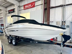 Sea Ray 220 Sundeck 2010 Sea Ray 220 Sundeck boat on trailer in indoor storage facility.