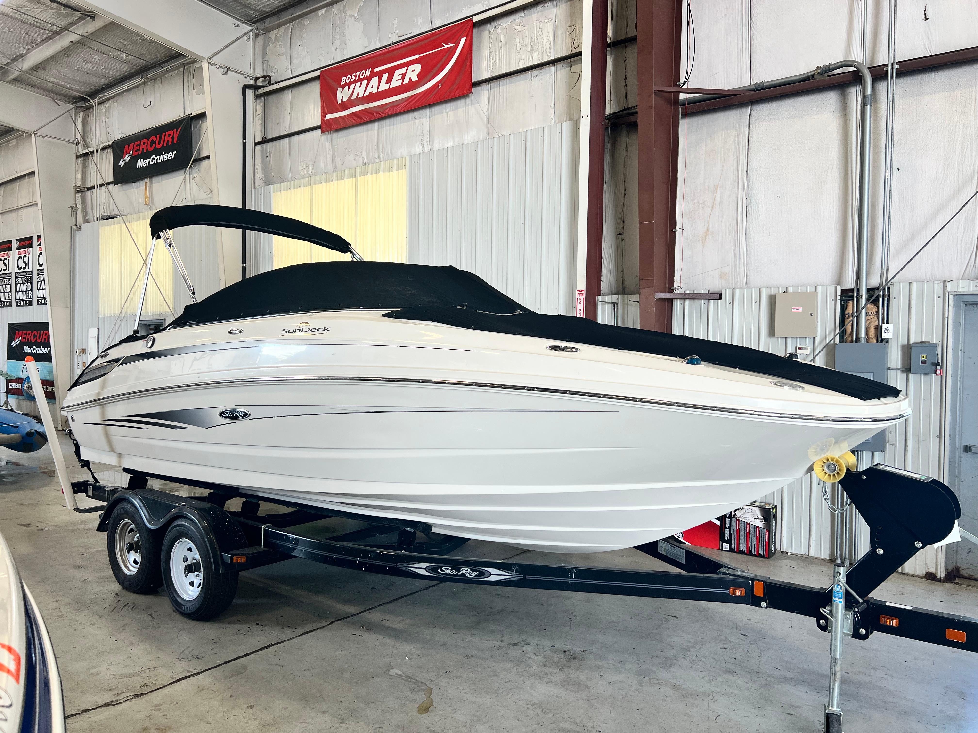 Sea Ray 220 Sundeck 2010 Sea Ray 220 Sundeck boat on trailer in indoor storage facility.