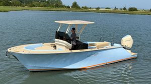 Lilybaeum Levenzo 2025 Lilybaeum Levenzo boat on calm water with a person steering.