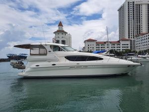 Sea Ray 480 Motor Yacht 2002 Sea Ray 480 Motor Yacht docked near luxury waterfront buildings.