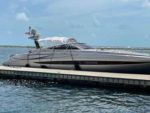 Riva Rivale Luxury 2012 Riva Rivale yacht docked on calm water under clear skies.