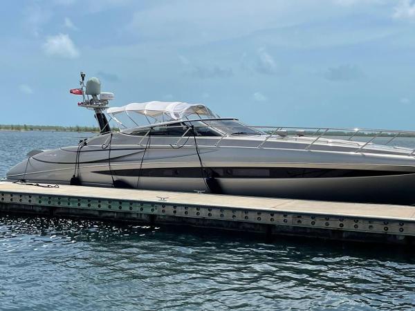 Riva Rivale Luxury 2012 Riva Rivale yacht docked on calm water under clear skies.