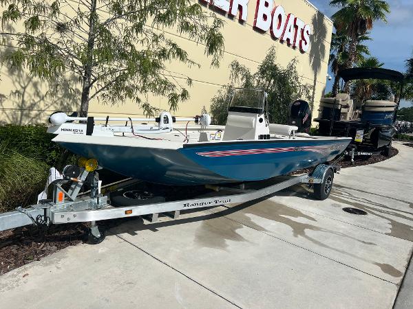Ranger RB190 2024 Ranger RB190 boat on trailer outside a dealership.