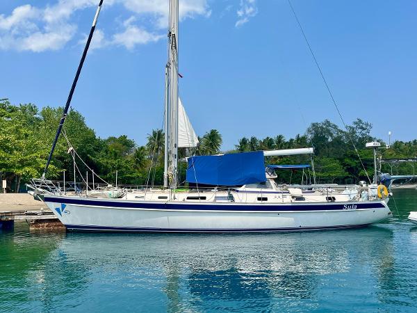 Hallberg-Rassy 53 2000 Hallberg-Rassy 53 sailboat docked in a serene marina setting.