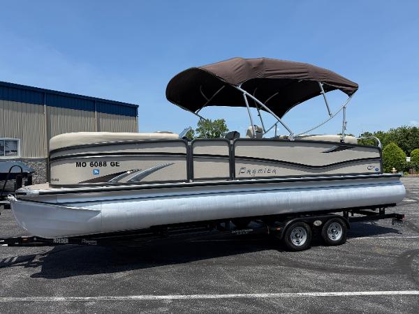 Premier 250 Solaris RF 2016 Premier 250 Solaris RF pontoon boat on trailer, parked outdoors.