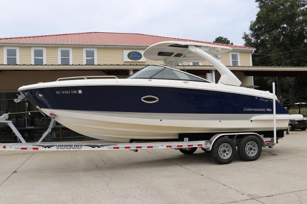 Chaparral 297 SSX 2019 Chaparral 297 SSX boat on trailer outside a building.