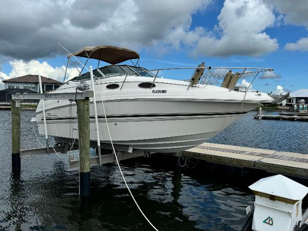 Chaparral Signature 260 2004 Chaparral Signature 260 boat docked at marina under cloudy sky.