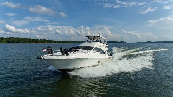 Sea Ray 58 Sedan Bridge 2006 Sea Ray 58 Sedan Bridge cruising on open water under a clear sky.