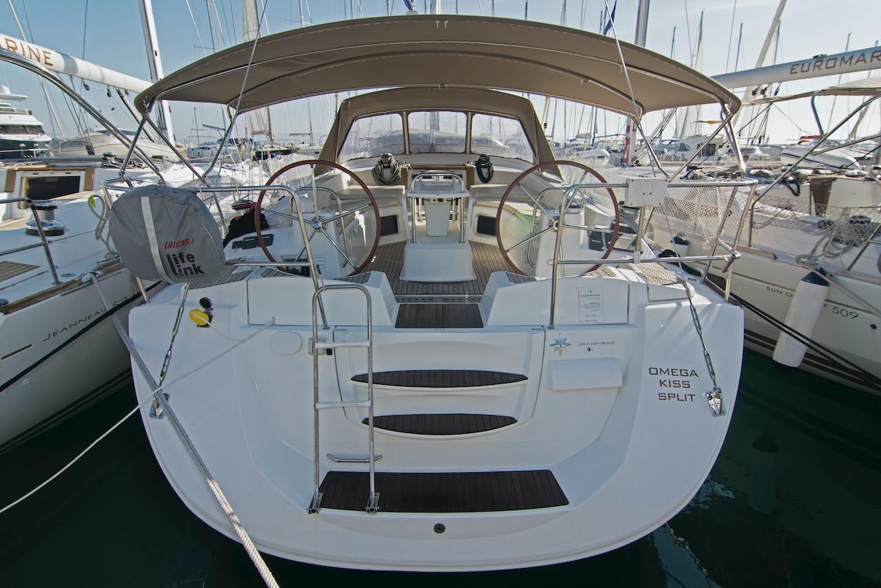 Jeanneau Jeanneau 53 2014 Jeanneau 53 sailboat with dual steering wheels docked at a marina.