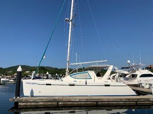 Admiral 40 Executive Owner's version 2009 Admiral 40 Executive Owner's version catamaran docked at marina under clear blue sky.